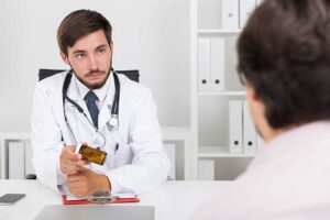doctor and client talk in a medication-assisted treatment program