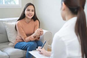 a person talks to a therapist during ecstasy addiction treatment 