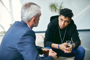 a person talks to a therapist during relapse prevention therapy 